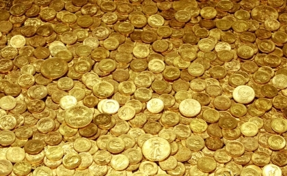 Експерт радить купувати золоті інвестиційні монети НБУ замість долара